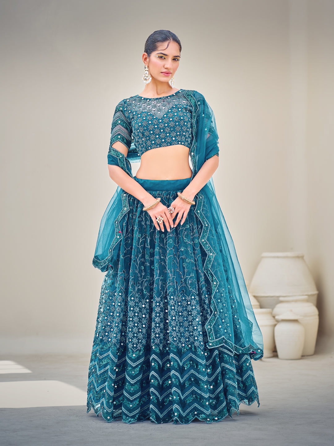 Blue Embroidered Sequined Semi-Stitched Lehenga Choli