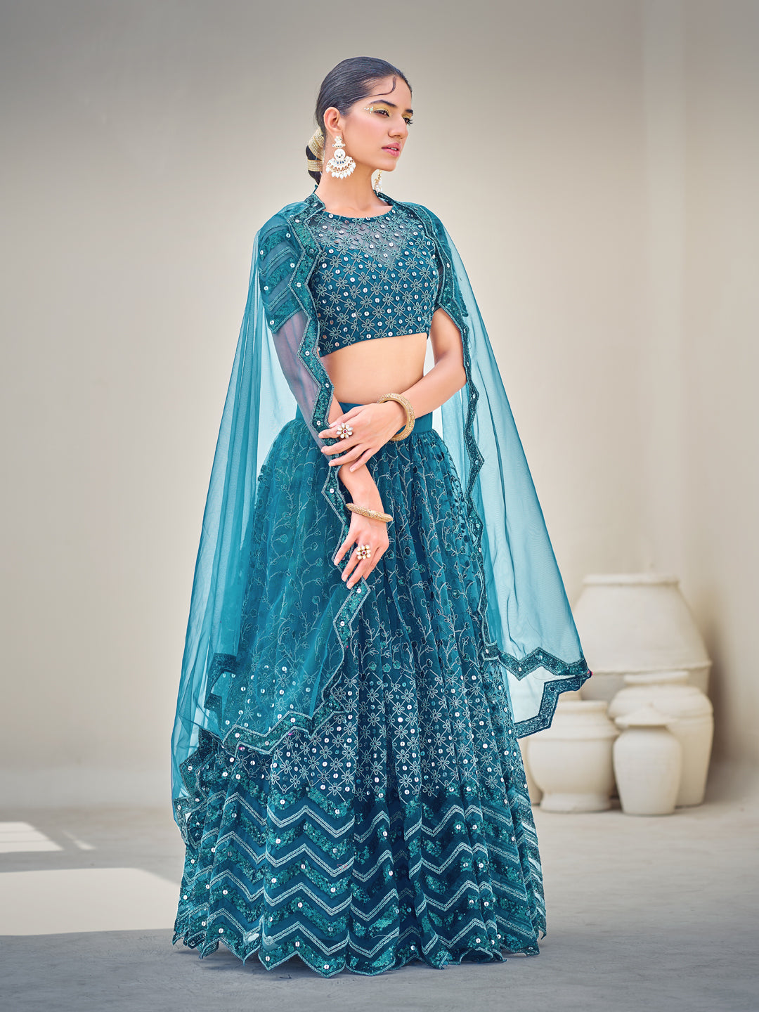 Blue Embroidered Sequined Semi-Stitched Lehenga Choli