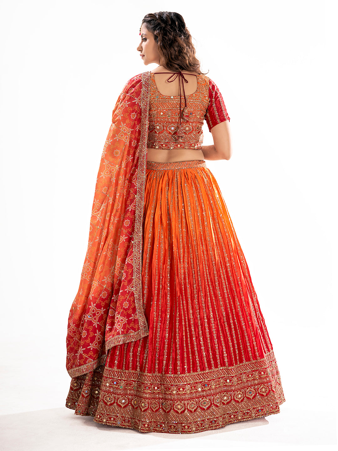 Orange Embroidered Sequined Semi-Stitched Lehenga Choli