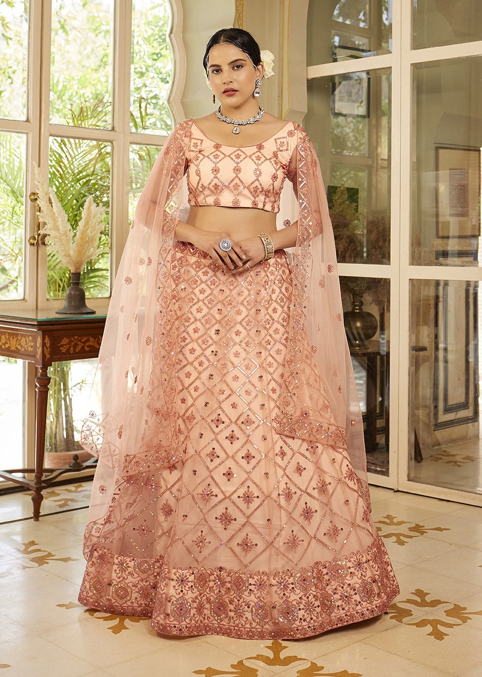 Fancy Peach Sequins Embroidered Net Lehenga Choli