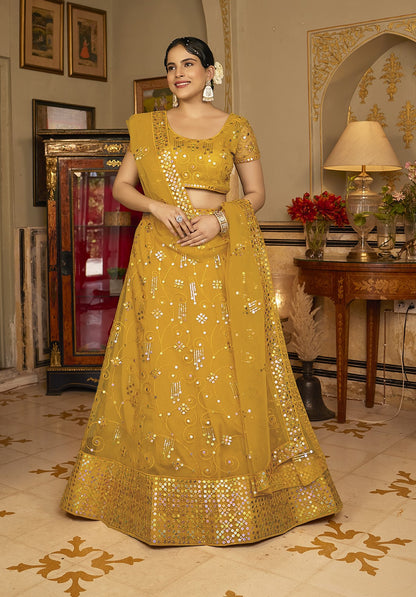 Deep Yellow Sequins Embroidered Net Lehenga Choli