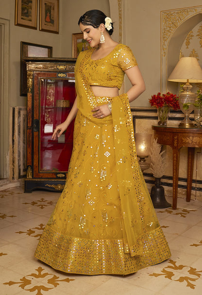 Deep Yellow Sequins Embroidered Net Lehenga Choli