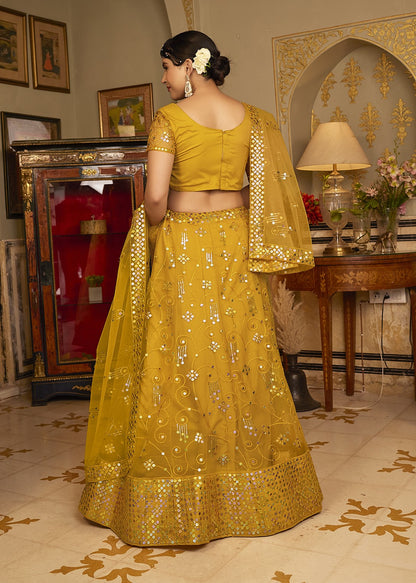 Deep Yellow Sequins Embroidered Net Lehenga Choli