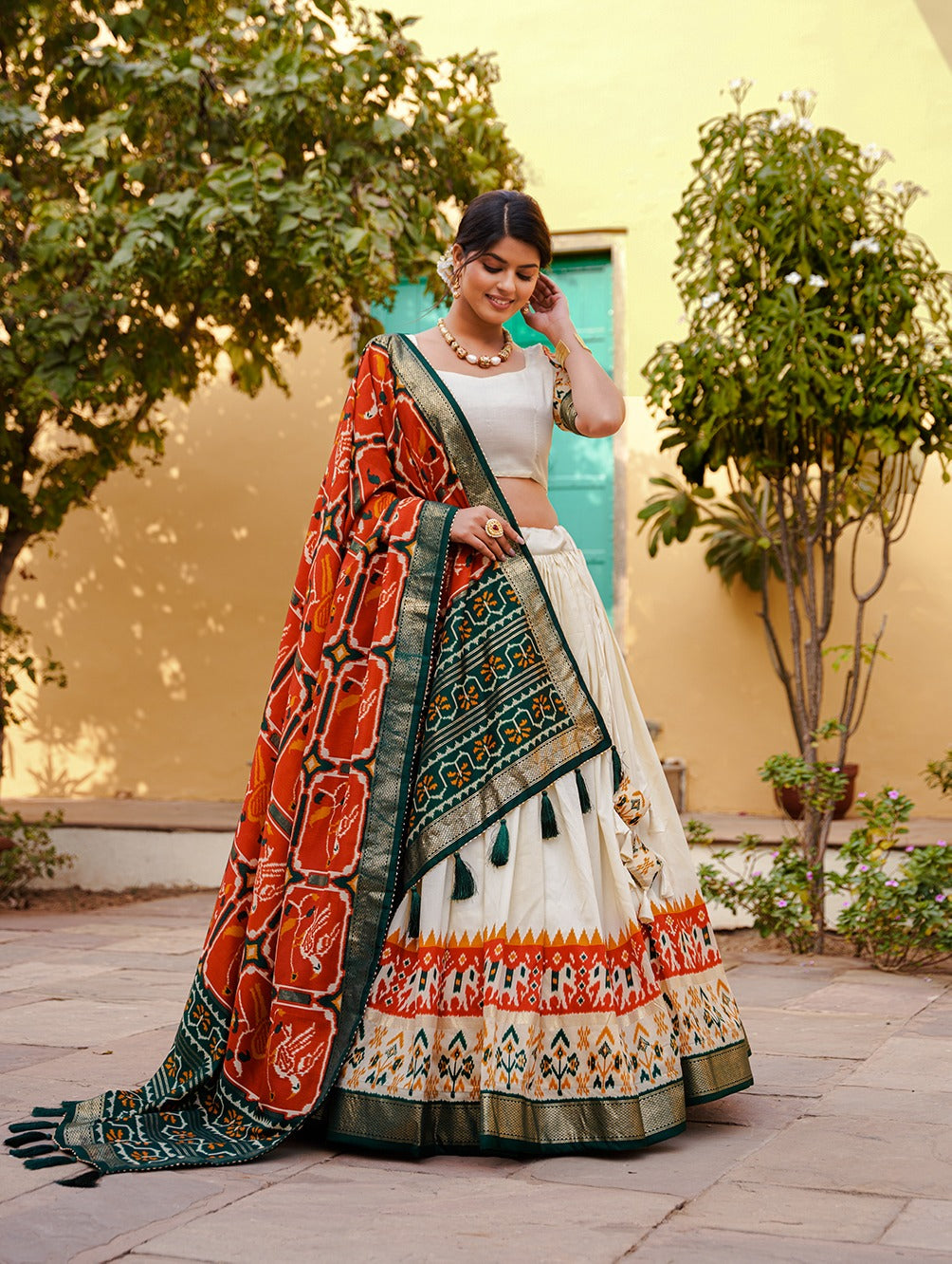 White & Orange Patola Silk Lehenga Choli With Contrast Dupatta