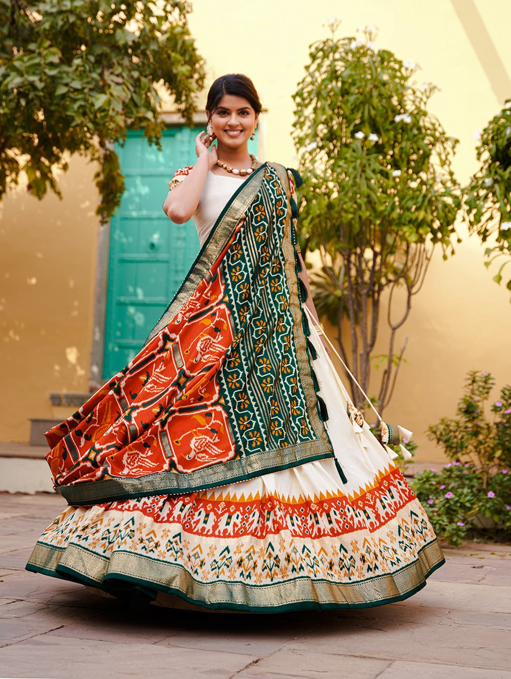 White & Orange Patola Silk Lehenga Choli With Contrast Dupatta