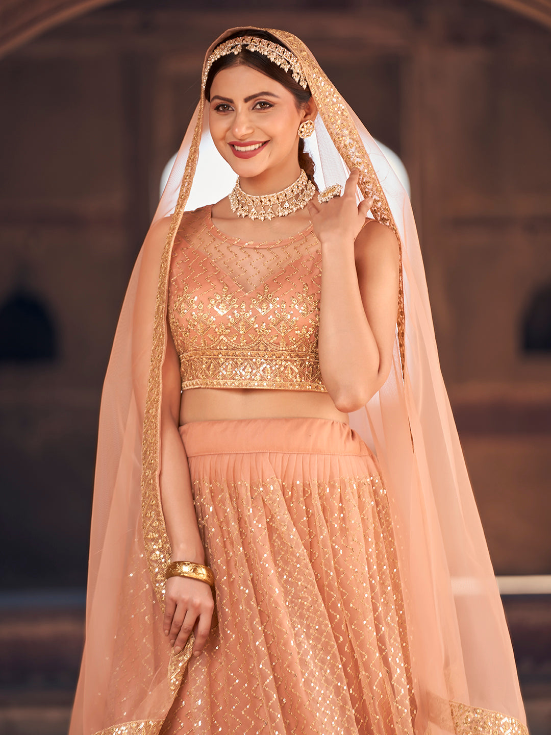 Elegant Peach Net Golden Embroidered Wedding Wear Lehenga Choli Set For Women