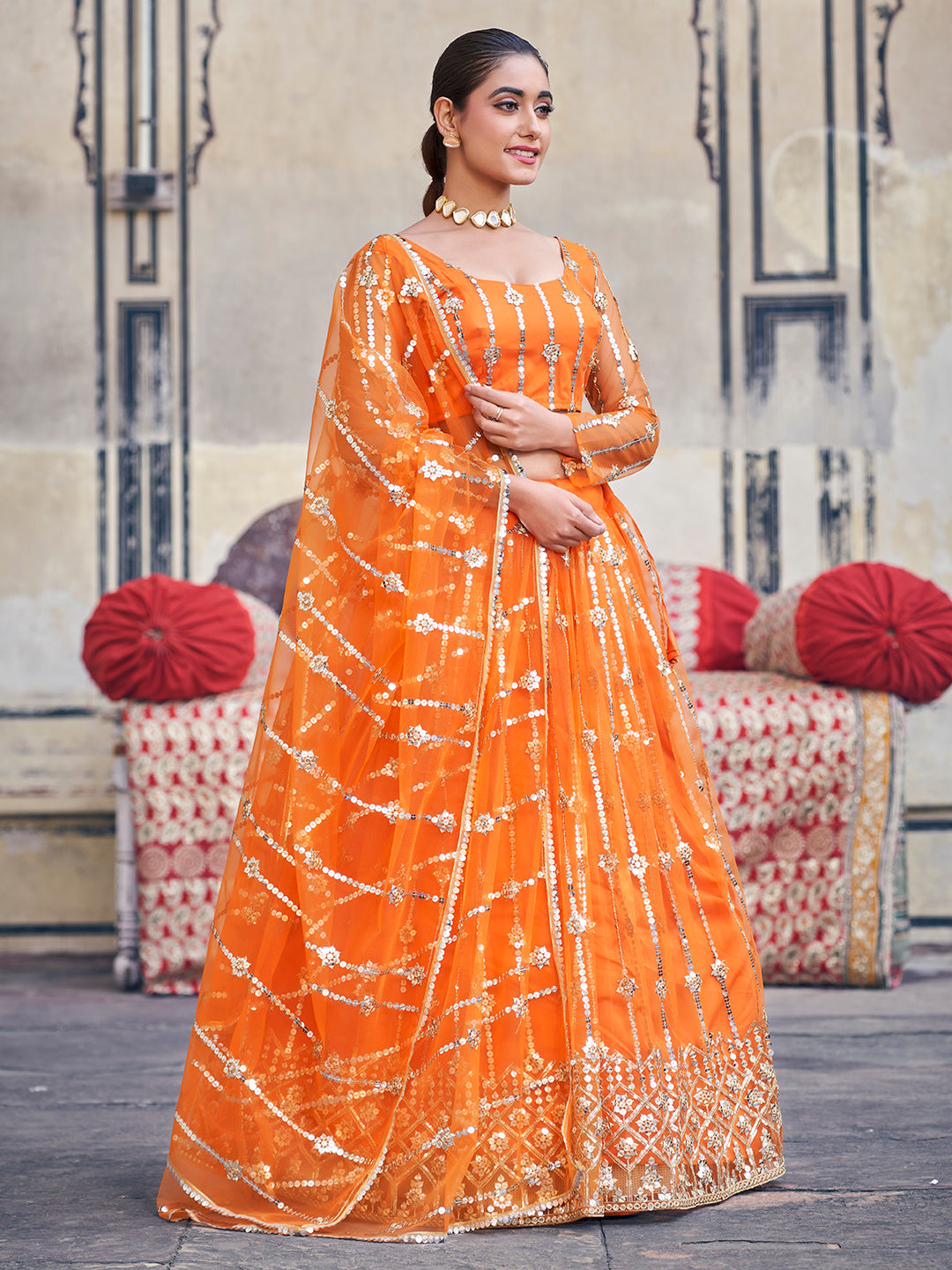 Stunning Orange Sequence Embroidered Soft Net Party Wear Lehenga Choli For Women