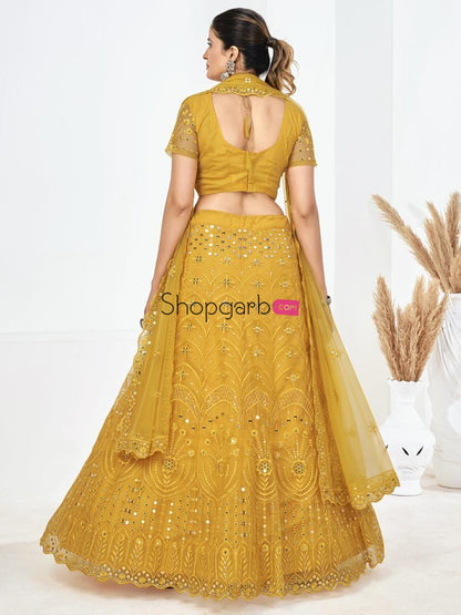 Yellow Sequins Embroidered Soft Net Festival Special Lehenga Choli